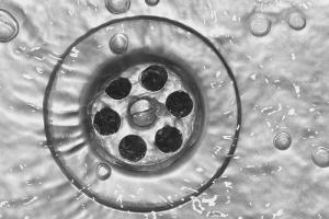 a clear drain in a recently augered shower